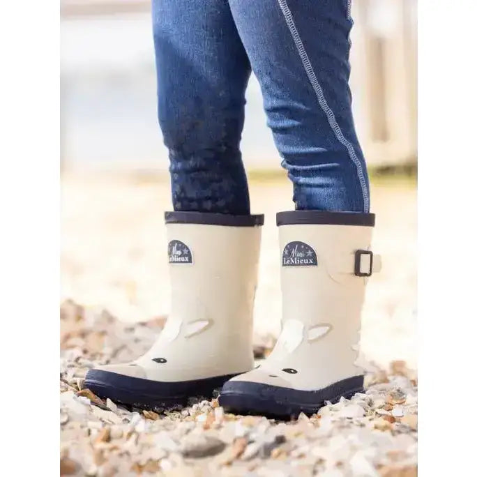 Cream lemieux puddle pals kids welly palomino rain boots with navy soles and bunny face design on the front