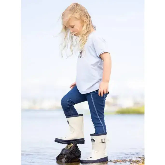 White rubber lemieux puddle pals kids welly palomino boots with black soles and buckle details for kids