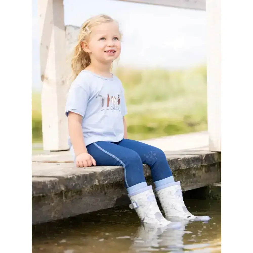 White rubber lemieux puddle pals kids welly sam boots with buckle strap and mud stains on the lower part