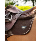 Brown leather saddle with lemieux puissance suede close quilted black pad showing close contact square style