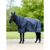 Navy blue waterproof horse rug with hood featuring lemieux rain sheet logo on the side for rainy days
