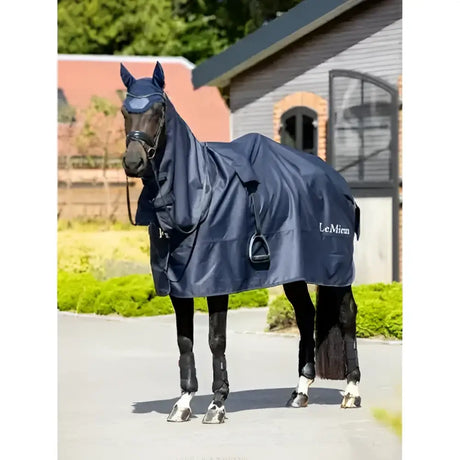 Navy blue lemieux rain sheet horse blanket with attached hood and adjustable straps for wet weather use