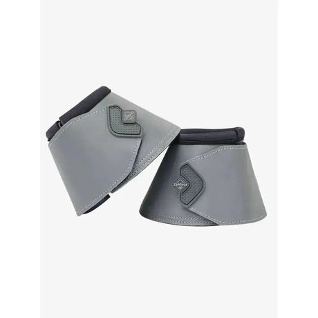 Gray leather lemieux reflective reach boots wrap with black trim and diamond logo protecting horse’s heel