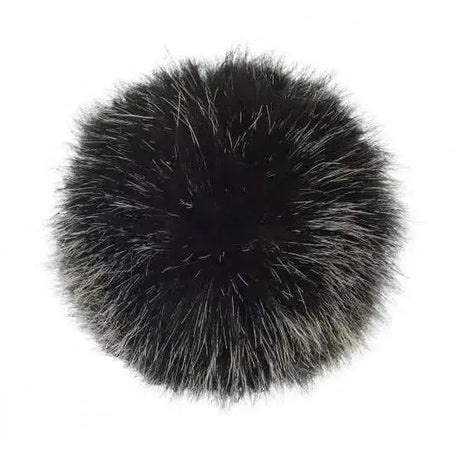 A plush round black fox fur lemieux replacement pom with soft fluffy texture and subtle silver-tipped strands