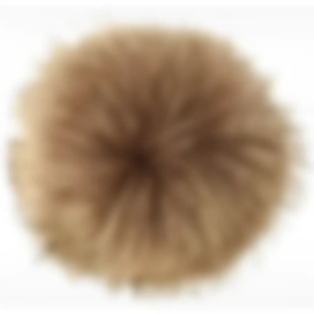 A fluffy round brown lemieux replacement pom made of soft textured material for lemieux hat silks replacement pom poms