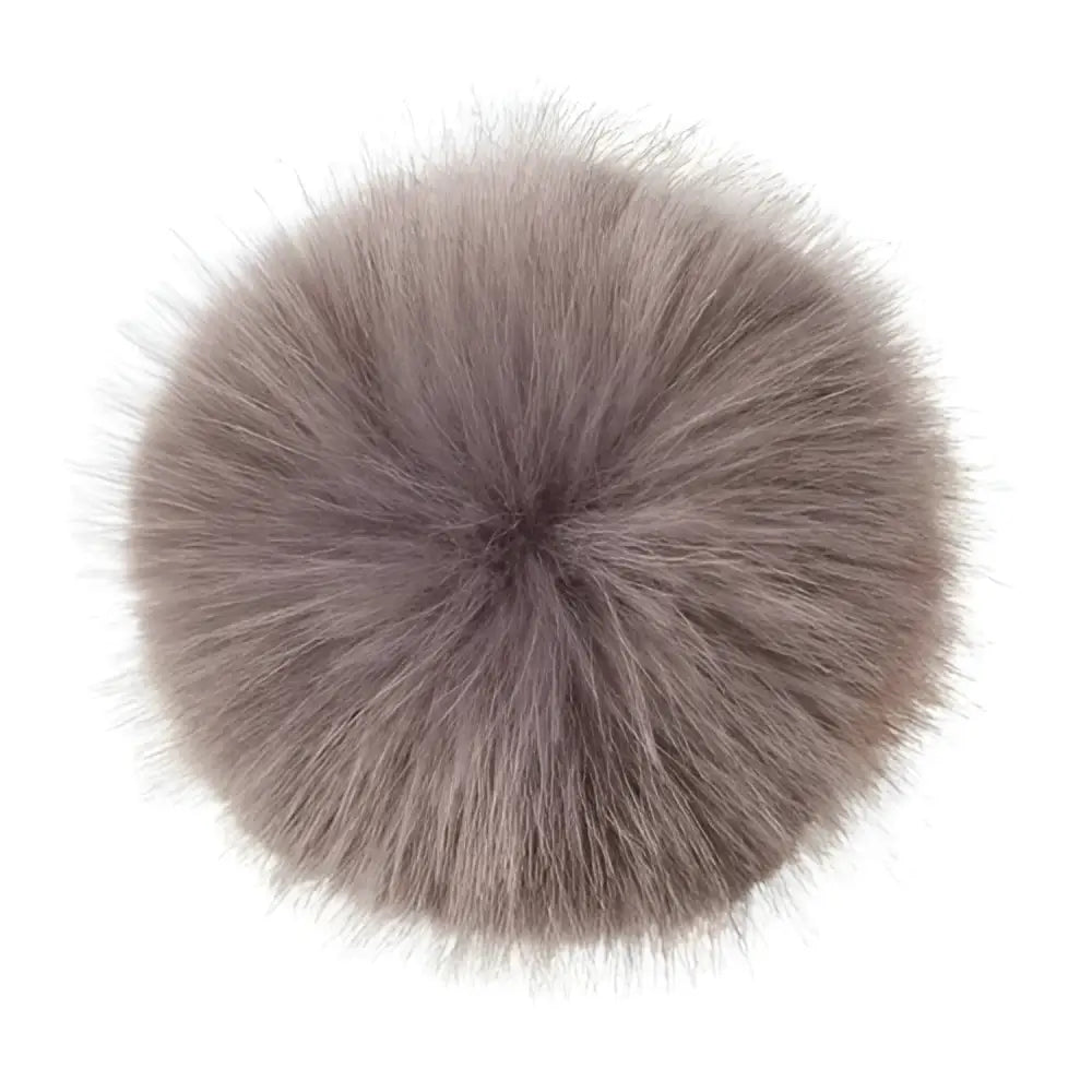 A plush round gray fox fur lemieux replacement pom perfect for refreshing your lemieux hat silks or replacement pom poms
