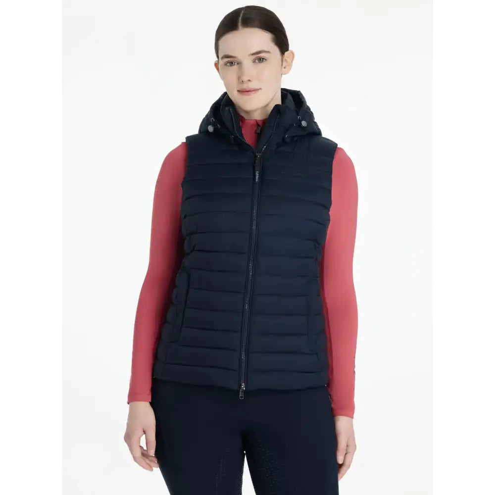 Navy blue quilted lemieux rose hooded puffer gilet with front zipper and snap buttons on hood for easy layering