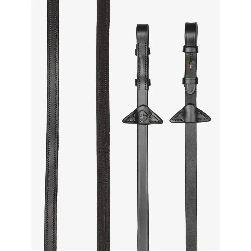 Black leather lemieux rubber half-lined reins with stitched edges and brass triangular buckles for riding use