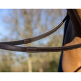 Black leather lemieux rubber half lined reins in brown with silver accents and reinforced stitching for durability