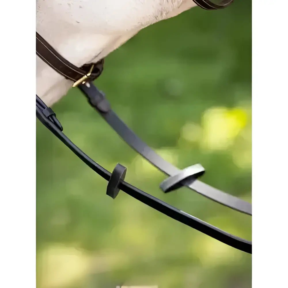 Black leather lemieux rubber rein with brass hardware and rubber rein stoppers black to prevent excessive movement