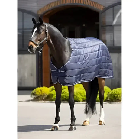 Navy blue quilted lemieux stable rugs rug liner 200g with black trim and white stitching for kudos turnout use
