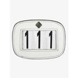 White lemieux saddle number holder made of leather with black numerals 111 and diamond logo on top