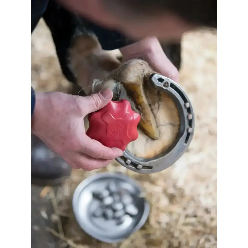 Red star-shaped lemieux safety stud tap with a textured surface and specially designed handle for easy use
