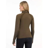 Brown turtleneck sweater worn by a woman, showcasing Lemieux Sara Snood Base Layer Alpine