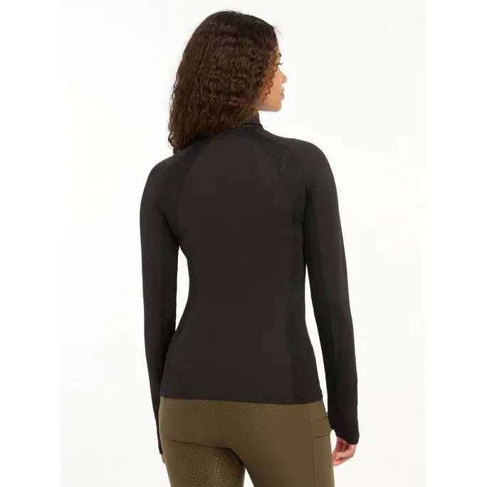 Black turtleneck sweater worn by a person showcasing Lemieux Sara Snood Base Layer