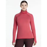 A vibrant coral lemieux sara snood long-sleeved base layer made from stretchy athletic fabric snood base layer cranberry