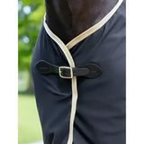 Black horse wearing lemieux scrim black cooler rug with cream trim and black leather buckle for cooling comfort