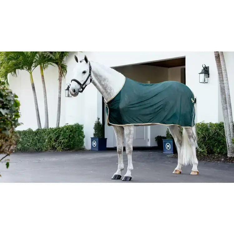 Dark green lemieux scrim green horse blanket with cream trim for comfortable riding and stable use