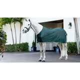 Dark green lemieux scrim green horse blanket with cream trim for comfortable riding and stable use