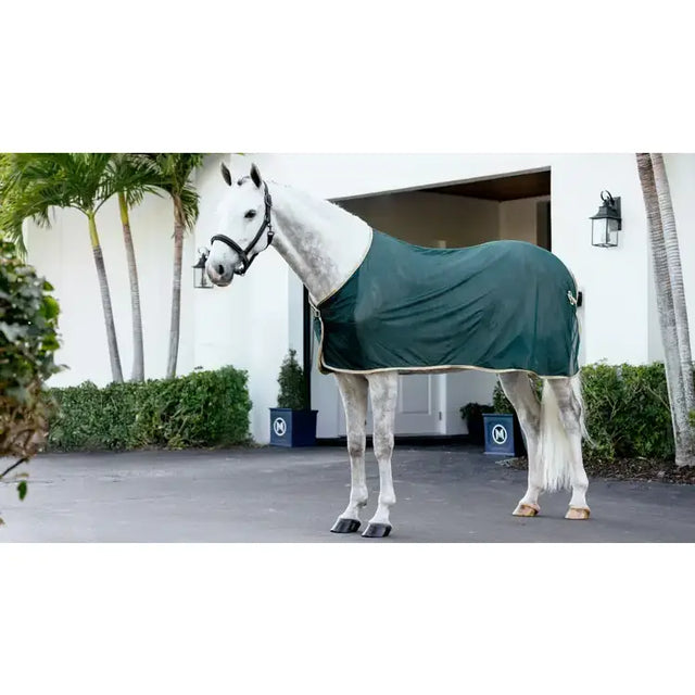 Dark green lemieux scrim green horse blanket with cream trim for comfortable riding and stable use