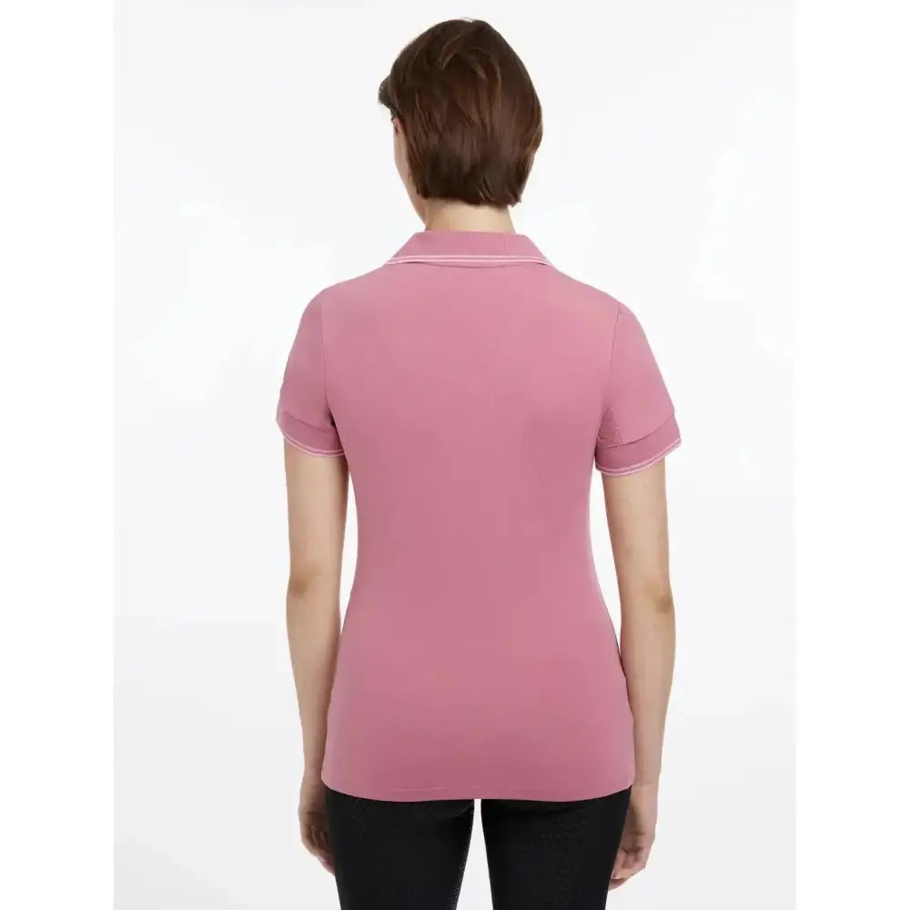 A soft pink lemieux serena sports polo with short sleeves ribbed trim and a classic collar perfect for sports polo peony style