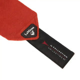 A vibrant red plush-felt scarf with a lemieux sienna classic black tag from the classic polo bandages set of 4