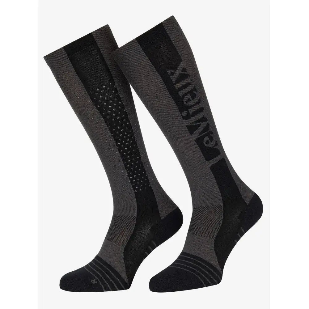 Graphite black and gray lemieux silicone performance sock with textured pattern and entrex branding for technical performance use