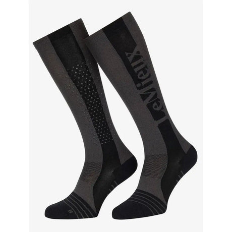 Graphite black and gray lemieux silicone performance sock with textured pattern and entrex branding for technical performance use