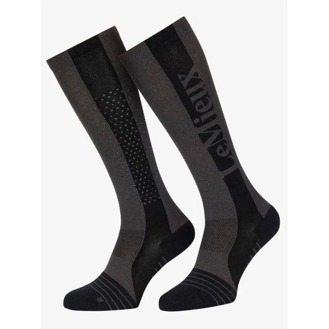Graphite black and gray lemieux silicone performance sock with textured pattern and entrex branding for technical performance use
