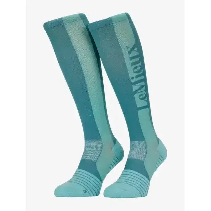 Teal and light teal lemieux silicone socks aqua with subtle mesh texture and vertical brand name lettering on the side