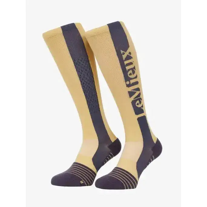 Beige and navy blue lemieux silicone socks mimosa with textured pattern and gold lemieux branding on the side