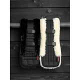 Black and white lemieux simuwool dressage girth cover natural with breathable half-lined sheepskin and adjustable straps