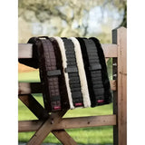 Four lemieux simuwool quilted saddle pads with cushioned faux lambswool edges and black natural girth cover lining