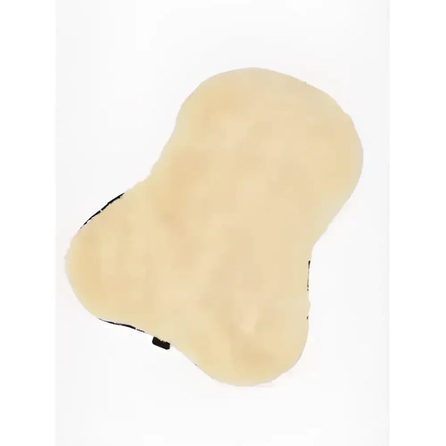 Cream-colored plush lemieux simuwool seat saver natural with fuzzy texture and black trim for car seats