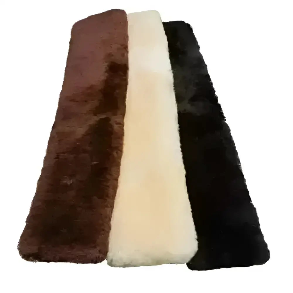 Three plush brown cream and black australian merino lambswool long girth sleeves for traditional girth use