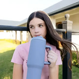 A sleek matte light blue lemieux sports cup powder blue insulated tumbler with a handle and wide mouth