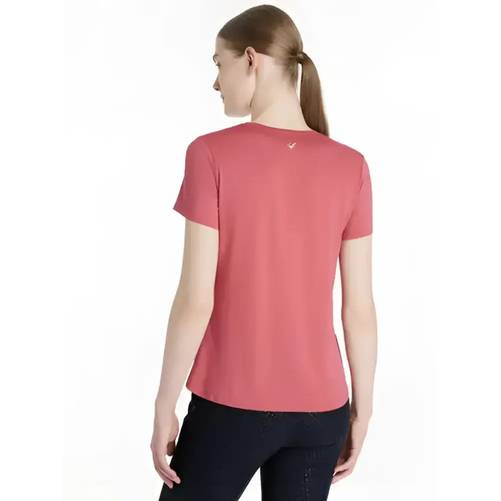 A coral-colored lemieux sports t-shirt with short sleeves and a subtle logo perfect for equestrian activities