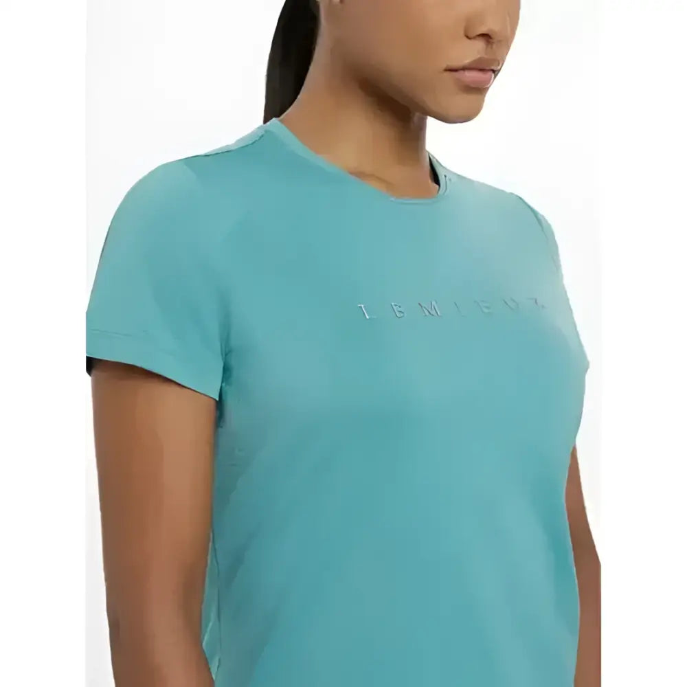 A light blue lemieux sports t-shirt with a subtle lemicos logo embroidered perfect for equestrian activities