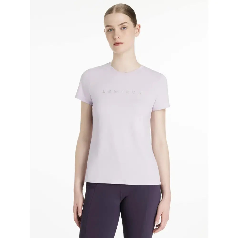 Light lavender lemieux sports t-shirt with short sleeves and iridescent levi’s logo perfect for equestrian use