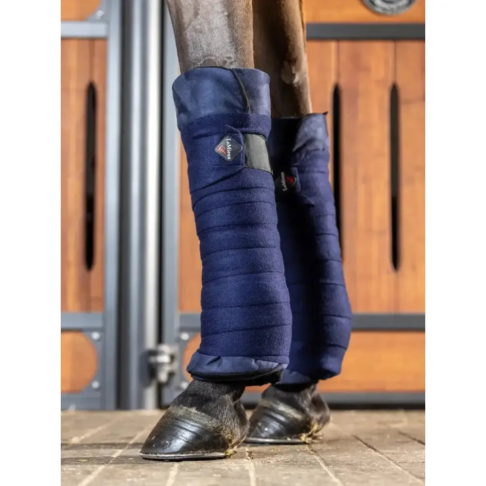 Navy blue quilted lemieux stable bandages with black strap and logo quality stable bandage pads for horse legs