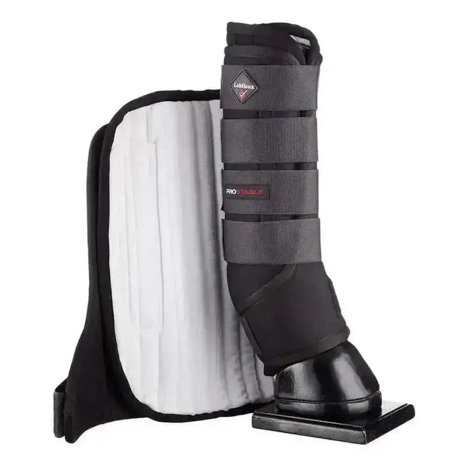Black and gray leather lemieux stable boots with white padded interior adjustable straps and diamond logo