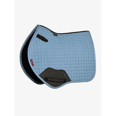 Light blue quilted lemieux suede close contact square ice blue saddle pad with black trim and dark gray front panel