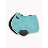 A light blue quilted lemieux suede close contact square lagoon saddle pad with black gray trim and padded design for comfort
