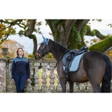 Dark brown horse wearing lemieux suede dressage square glacier in light blue suede dressage square saddle and bridle
