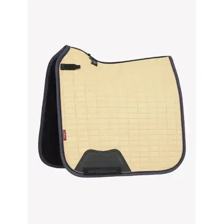 Beige quilted lemieux suede dressage square mimosa with black trim and branded logo on corner for dressage use