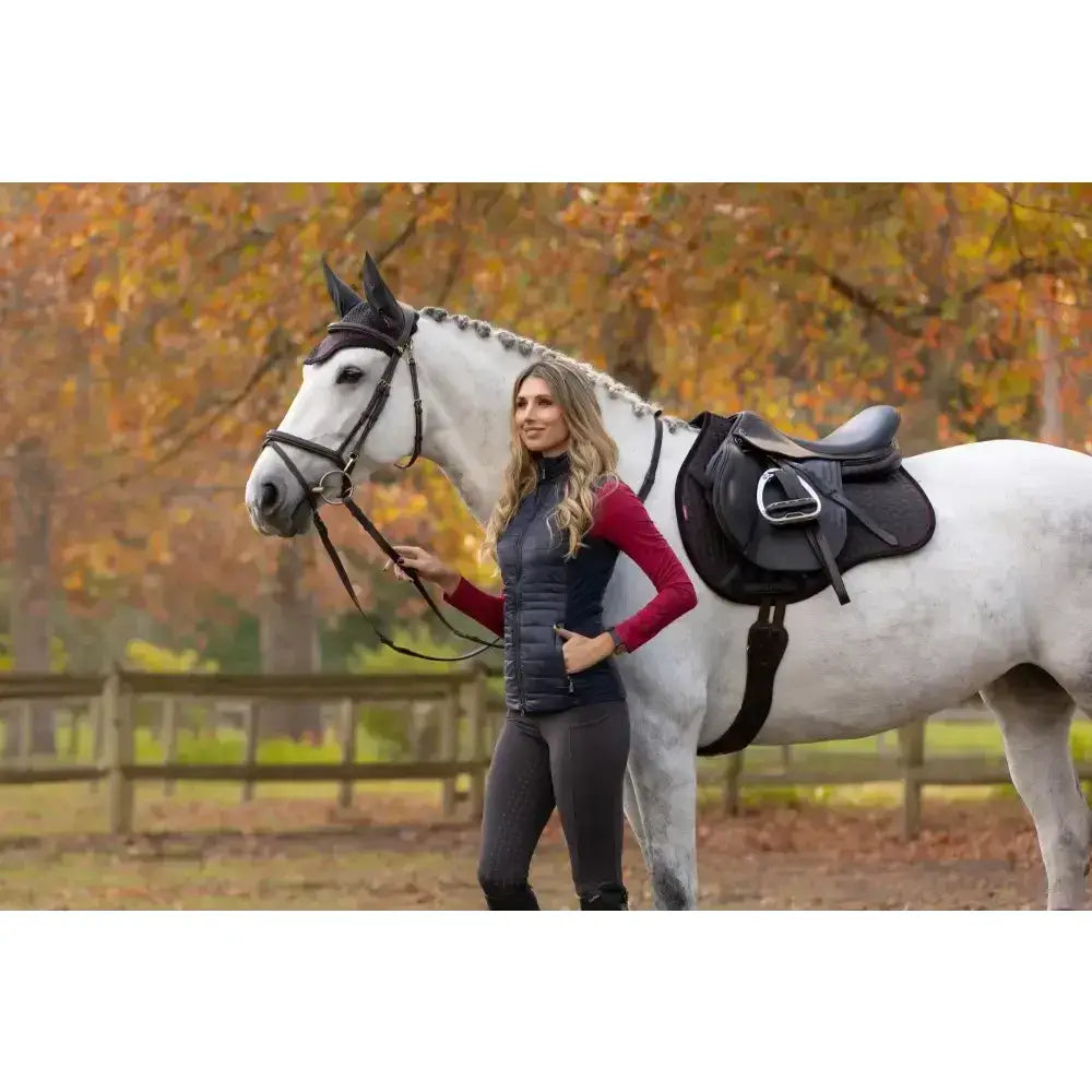Black leather saddle with silver buckle on white horse featuring lemieux suede gp square classic general purpose design