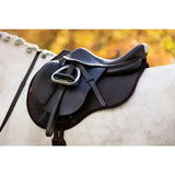 Black english saddle with silver stirrup iron and leather straps on white horse lemieux suede gp square cinder
