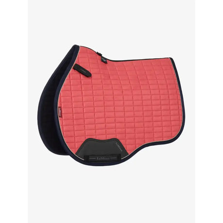 Coral pink lemieux suede gp square cranberry saddle pad with navy edges and black trim in a sleek design