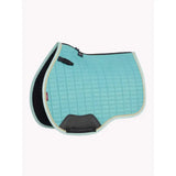 A light blue lemieux suede gp square lagoon saddle pad with black and gray accents and a branded logo on the side