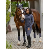 Blue lemieux tabi tech zip through hoodie dusk blue paired with matching leggings and tall boots for riding